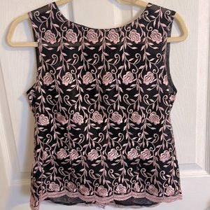Beautiful, handmade, sleeveless lace shirt. Fits a size medium.